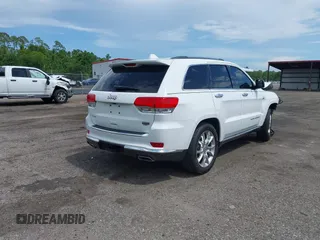 2014 Jeep Grand Cherokee Summit with VIN 1C4RJFJT6EC281114, listed as a IAAI auction lot 42497582 with 128,181 mi miles and . Bid and sale history available at DreamBid. Image 4.