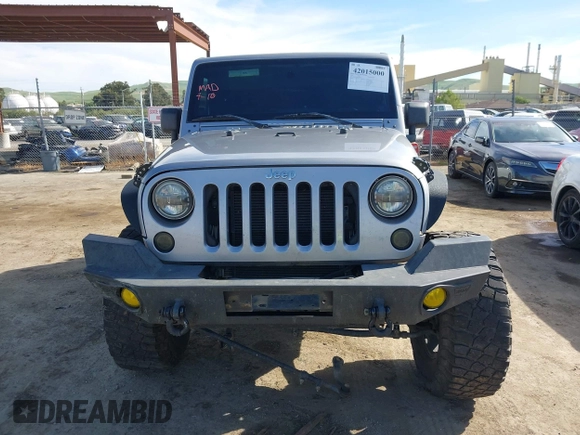 2014 Jeep Wrangler Sport with VIN 1C4AJWAG5EL206565, listed as a IAAI auction lot 42015000 with 90,129 mi miles and . Bid and sale history available at carsss.com. Image 12.