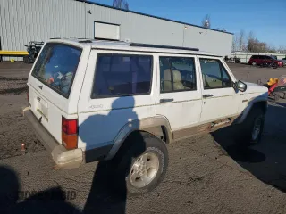 1993 Jeep Cherokee Country with VIN 1J4FJ78S0PL565292, listed as a Copart auction lot 83214974 with 233,925 mi miles and Clean Title. Bid and sale history available at carsss.com. Image 3.