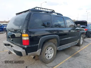 2004 Chevrolet Tahoe LS with VIN 1GNEK13T64R265302, listed as a IAAI auction lot 41445237 with 242,840 mi miles. Bid and sale history available at carsss.com. Image 4.