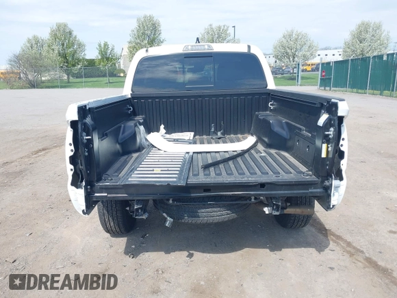 2023 Toyota Tacoma SR with VIN 3TMCZ5AN2PM642205, listed as a IAAI auction lot 42167945 with 10,595 mi miles and . Bid and sale history available at DreamBid. Image 17.