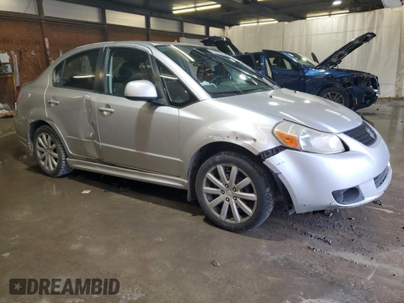 2010 Suzuki SX4 with VIN JS2YC5A49A6310256, listed as a Copart auction lot 73210584 with 135,021 mi miles and Salvage Title. Bid and sale history available at DreamBid. Image 4.