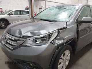 2013 Honda CR-V EX with VIN 2HKRM4H59DH682484, listed as a IAAI auction lot 41504589 with 208,260 mi miles and . Bid and sale history available at DreamBid. Image 6.