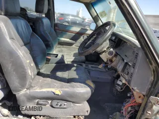 1995 Jeep Cherokee with VIN 1J4FN78S5SL557086, listed as a Copart auction lot 74221184 with 416,415 mi miles and Salvage title. Bid and sale history available at DreamBid. Image 7.