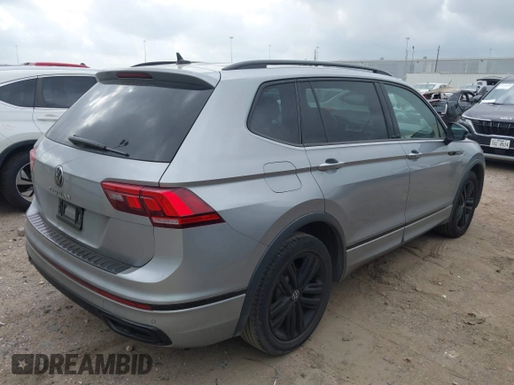 2022 Volkswagen Tiguan SE R-Line Black with VIN 3VVCB7AXXNM165748, listed as a IAAI auction lot 42178772 with 64,007 mi miles and . Bid and sale history available at DreamBid. Image 4.