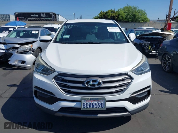 2017 Hyundai Santa Fe 2.4L z VIN 5XYZTDLB0HG403842, wystawiony jako IAAI lot #42206543 z przebiegiem 77 900 mil mil oraz . Historia ofert i sprzedaży dostępna na DreamBid. Obrazek 13.