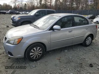 2010 Kia Rio LX with VIN KNADH4A38A6627955, listed as a Copart auction lot 43702265 with 138,005 mi miles and Non Repairable. Bid and sale history available at carsss.com. Image 1.