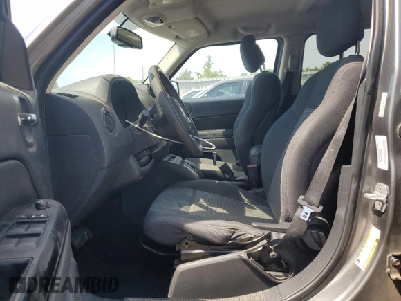 2011 Jeep Patriot Sport with VIN 1J4NT1GB6BD287389, listed as a Copart auction lot 56495085 with 188,650 mi miles and Salvage title. Bid and sale history available at DreamBid. Image 7.