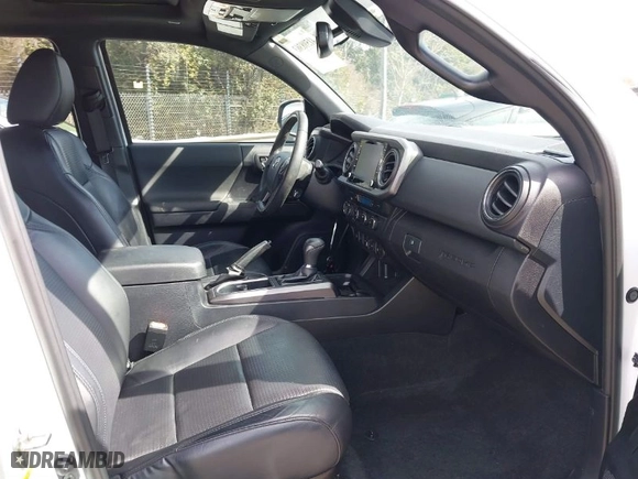 2020 Toyota Tacoma 4WD SR5 with VIN 3TMCZ5AN3LM309635, listed as a IAAI auction lot 41598363 with 99,080 mi miles. Bid and sale history available at carsss.com. Image 5.