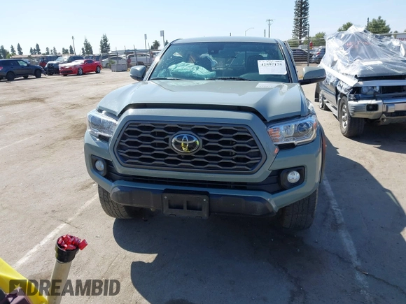 2022 Toyota Tacoma SR with VIN 3TMCZ5AN0NM489420, listed as a IAAI auction lot 42597175 with 129,340 mi miles and . Bid and sale history available at DreamBid. Image 13.