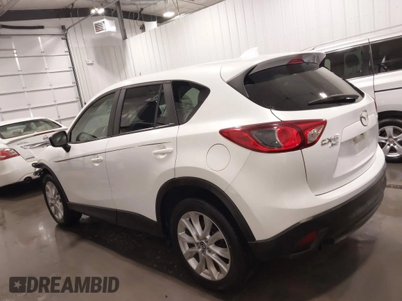 2015 Mazda CX-5 Grand Touring with VIN JM3KE4DY4F0495627, listed as a IAAI auction lot 41887773 with 130,421 mi miles. Bid and sale history available at carsss.com. Image 15.
