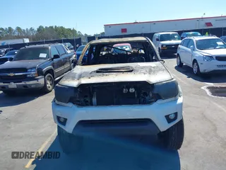 2014 Toyota Tacoma with VIN 5TFLU4EN0EX098815, listed as a IAAI auction lot 41675606 with 89,365 mi miles. Bid and sale history available at carsss.com. Image 6.
