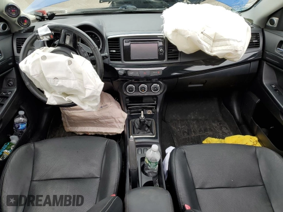 2015 Mitsubishi Lancer Evolution GSR z VIN JA32W8FV7FU023106, wystawiony jako Copart lot #40867084 z przebiegiem 103 964 mil mil oraz Szkoda całkowita • Salvage title. Historia ofert i sprzedaży dostępna na DreamBid. Obrazek 8.