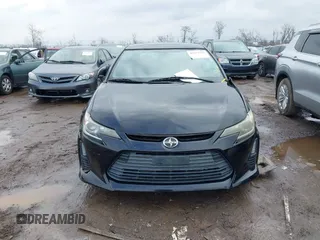 2014 Scion tC with VIN JTKJF5C74E3069104, listed as a IAAI auction lot 41579797 with 130,668 mi miles. Bid and sale history available at carsss.com. Image 12.