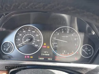 2015 BMW 4 Series 428i with VIN WBA4A5C51FG051393, listed as a IAAI auction lot 42041960 with 136,929 mi miles and . Bid and sale history available at carsss.com. Image 7.