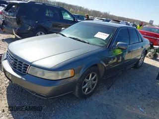 2003 Cadillac Seville Luxury SLS z VIN 1G6KS54Y43U158390, wystawiony jako IAAI lot #41977830 z przebiegiem 299 000 mil mil oraz . Historia ofert i sprzedaży dostępna na DreamBid. Obrazek 2.