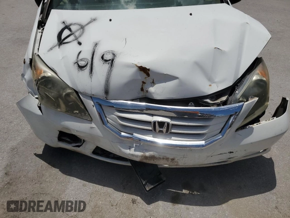 2010 Honda Odyssey LX with VIN 5FNRL3H23AB032112, listed as a Copart auction lot 60876035 with 223,335 mi miles and Salvage title. Bid and sale history available at DreamBid. Image 12.