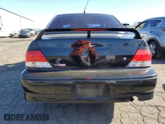 2002 Mitsubishi Lancer OZ-Rally z VIN JA3AJ86E92U027551, wystawiony jako Copart lot #45020575 z przebiegiem 214 575 mil mil oraz Szkoda całkowita • Salvage title. Historia ofert i sprzedaży dostępna na DreamBid. Obrazek 6.