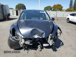 2024 Tesla Model Y Long Range с VIN 7SAYGDEE4RA243738, выставлен на аукционе Copart как лот 48953885 с пробегом Не указан миль и Списание • Salvage title. История ставок и продаж доступна на DreamBid. Изображение 5.