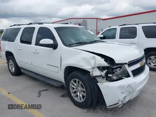 2014 Chevrolet Suburban LT with VIN 1GNSCJE02ER153469, listed as a IAAI auction lot 42481563 with 249,441 mi miles and . Bid and sale history available at DreamBid. Image 1.