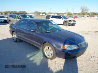 2002 Mazda 626 LX with VIN 1YVGF22D925287959, listed as a IAAI auction lot 41610932 with 122,333 mi miles. Bid and sale history available at carsss.com. Image 1.