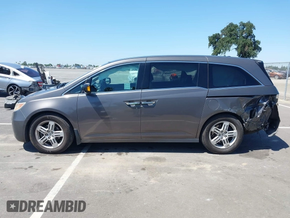 2012 Honda Odyssey Touring with VIN 5FNRL5H98CB011297, listed as a IAAI auction lot 42207061 with 154,073 mi miles and . Bid and sale history available at DreamBid. Image 14.