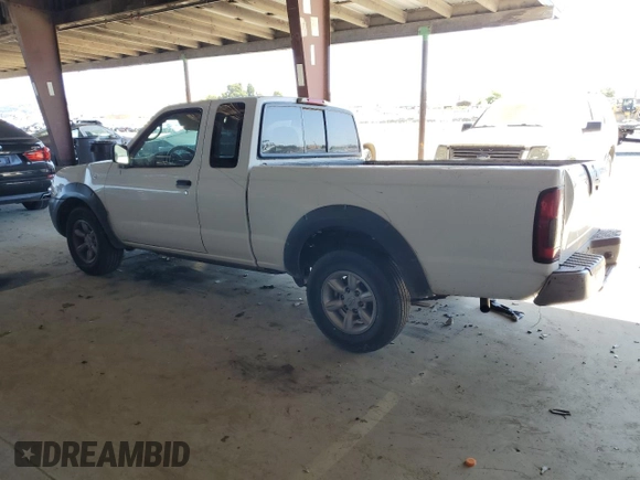 2002 Nissan Frontier XE with VIN 1N6DD26S02C309301, listed as a Copart auction lot 64142805 with 237,523 mi miles and Salvage title. Bid and sale history available at DreamBid. Image 2.