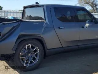 2024 Rivian R1T Adventure with VIN 7FCTGBAA1RN032543, listed as a Copart auction lot 69800484 with Not Provided miles and Salvage Title. Bid and sale history available at carsss.com. Image 3.
