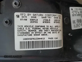 2001 Saturn SL z VIN 1G8ZK52761Z204012, wystawiony jako Copart lot #86618384 z przebiegiem 99 674 mil mil oraz Szkoda całkowita • Salvage title. Historia ofert i sprzedaży dostępna na DreamBid. Obrazek 12.