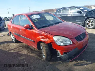 2008 Kia Rio LX with VIN KNADE123486387187, listed as a IAAI auction lot 41770395 with 113,663 mi miles. Bid and sale history available at carsss.com. Image 1.