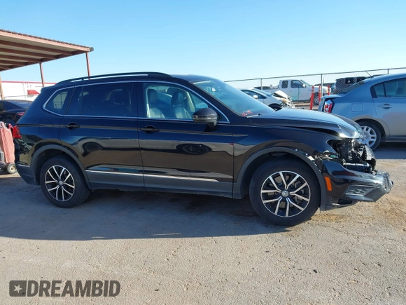 2021 Volkswagen Tiguan SE z VIN 3VV3B7AX0MM080853, wystawiony jako IAAI lot #42406539 z przebiegiem 73 295 mil mil oraz . Historia ofert i sprzedaży dostępna na DreamBid. Obrazek 14.