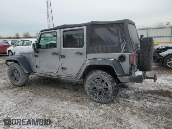 2015 Jeep Wrangler Unlimited Willys Wheeler with VIN 1C4BJWDG9FL516493, listed as a Copart auction lot 45098345 with 152,009 mi miles and Salvage Title. Bid and sale history available at DreamBid. Image 2.