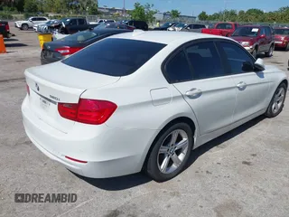 2014 BMW 3 Series 320i with VIN WBA3B1G53ENT00444, listed as a IAAI auction lot 42082984 with 94,401 mi miles. Bid and sale history available at carsss.com. Image 4.