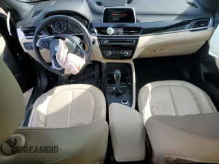 2018 BMW X1 xDrive28i with VIN WBXHT3C31J5K25021, listed as a Copart auction lot 48779555 with 71,741 mi miles and Salvage Title. Bid and sale history available at carsss.com. Image 8.
