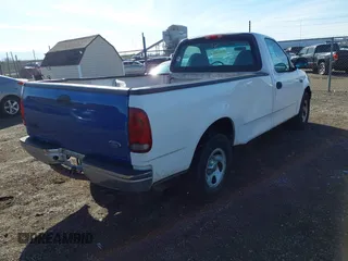 2002 Ford F-150 XL with VIN 3FTRF17232MA23677, listed as a IAAI auction lot 41849534 with 1 mi miles. Bid and sale history available at carsss.com. Image 4.