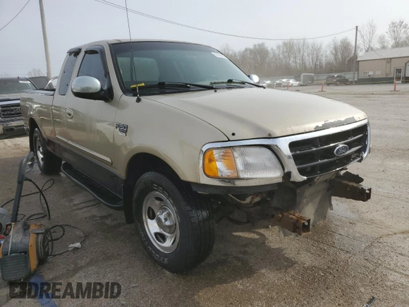 2000 Ford F-150 XL with VIN 2FTRX17W0YCA73568, listed as a Copart auction lot 51128035 with 208,737 mi miles and Salvage Title. Bid and sale history available at carsss.com. Image 4.