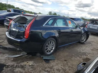 2014 Cadillac CTS with VIN 1G6DH8E3XE0134312, listed as a Copart auction lot 61556874 with 77,194 mi miles and Salvage Title. Bid and sale history available at DreamBid. Image 3.