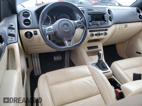 2014 Volkswagen Tiguan SEL with VIN WVGAV3AX7EW101796, listed as a Copart auction lot 60904345 with 97,652 mi miles and Salvage title. Bid and sale history available at DreamBid. Image 8.