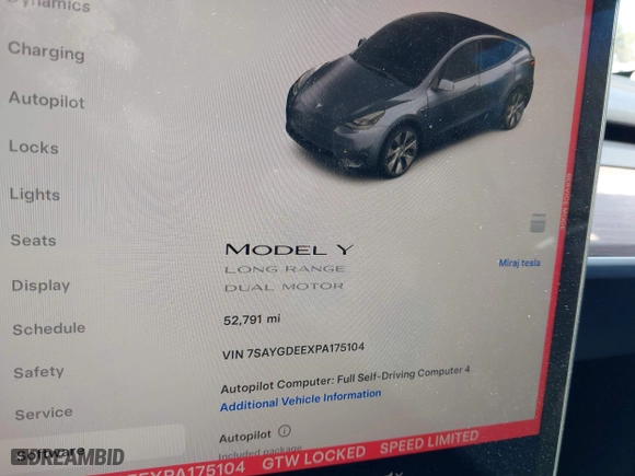 2023 Tesla Model Y Long Range with VIN 7SAYGDEEXPA175104, listed as a IAAI auction lot 41821928 with 52,791 mi miles. Bid and sale history available at carsss.com. Image 7.