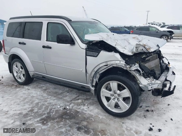 2011 Dodge Nitro Heat with VIN 1D4PU4GX1BW607458, listed as a IAAI auction lot 41279270 with 90,969 mi miles. Bid and sale history available at carsss.com. Image 1.