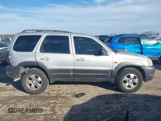 2003 Mazda Tribute LX with VIN 4F2YZ04183KM44733, listed as a IAAI auction lot 41472662 with 246,522 mi miles and . Bid and sale history available at DreamBid. Image 13.