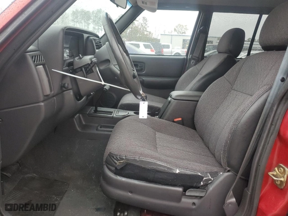 1999 Jeep Cherokee Sport with VIN 1J4FT68S1XL601799, listed as a Copart auction lot 83881844 with 203,572 mi miles and Salvage Title. Bid and sale history available at carsss.com. Image 7.