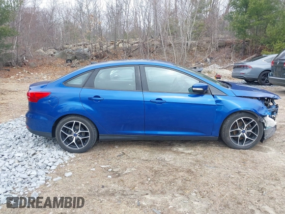 2018 Ford Focus SE z VIN 1FADP3F25JL255840, wystawiony jako IAAI lot #41852913 z przebiegiem 64 010 mil mil oraz . Historia ofert i sprzedaży dostępna na DreamBid. Obrazek 13.
