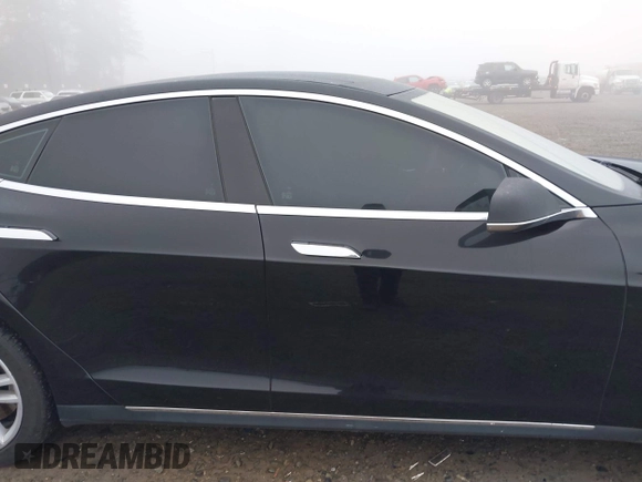 2014 Tesla Model S 60 with VIN 5YJSA1H1XEFP36008, listed as a IAAI auction lot 41287240 with 48,171 mi miles and . Bid and sale history available at DreamBid. Image 14.