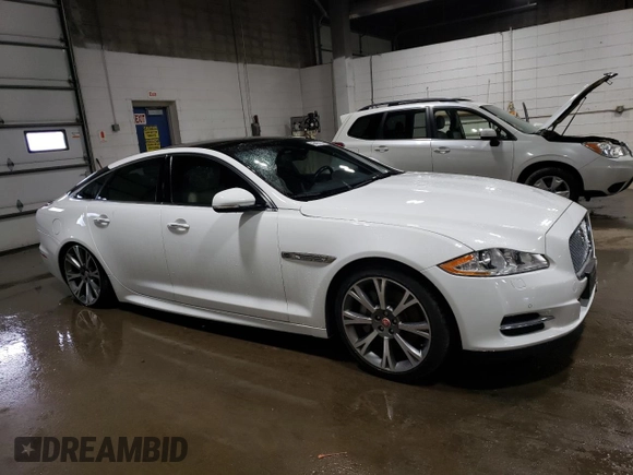 2015 Jaguar XJ with VIN SAJWJ1CD3F8V89374, listed as a Copart auction lot 49416114 with 94,636 mi miles and . Bid and sale history available at DreamBid. Image 4.