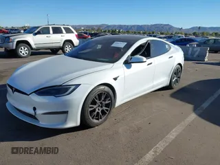 2022 Tesla Model S Plaid with VIN 5YJSA1E64NF479959, listed as a IAAI auction lot 41057673 with 27,203 mi miles and . Bid and sale history available at DreamBid. Image 6.