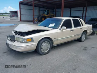 1996 Lincoln Town Car Cartier with VIN 1LNLM83W7TY634343, listed as a IAAI auction lot 42474123 with 193,705 mi miles and . Bid and sale history available at DreamBid. Image 2.