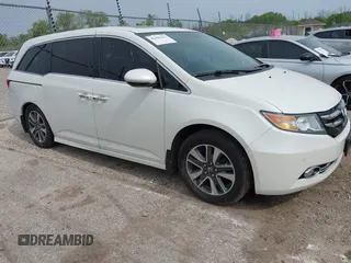 2015 Honda Odyssey Touring Elite with VIN 5FNRL5H90FB094731, listed as a IAAI auction lot 42405455 with 167,235 mi miles and . Bid and sale history available at DreamBid. Image 1.