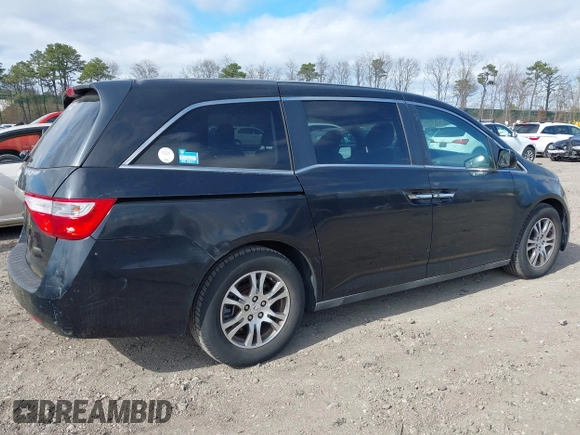 2011 Honda Odyssey EX with VIN 5FNRL5H4XBB011918, listed as a IAAI auction lot 42056043 with 201,821 mi miles and . Bid and sale history available at carsss.com. Image 4.