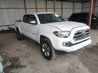 2016 Toyota Tacoma Limited with VIN 3TMEZ5CN4GM001966, listed as a IAAI auction lot 41502950 with 99,454 mi miles and . Bid and sale history available at DreamBid. Image 1.
